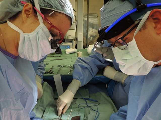 Close up of surgeons in operating room