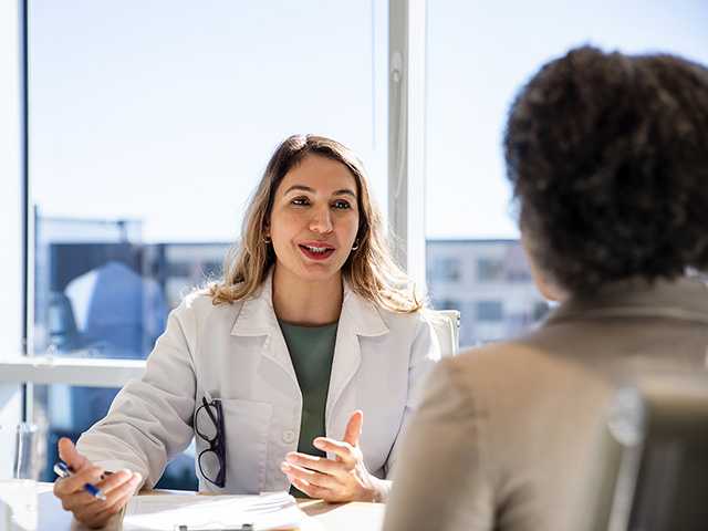 female patient having a meeting with a member of the hospital staff