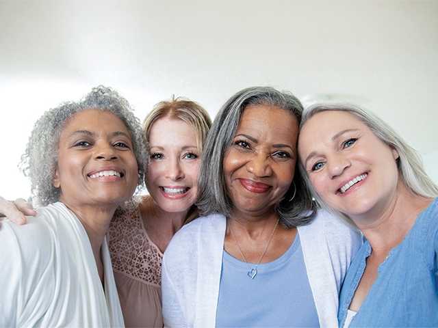 Group of happy women smiling