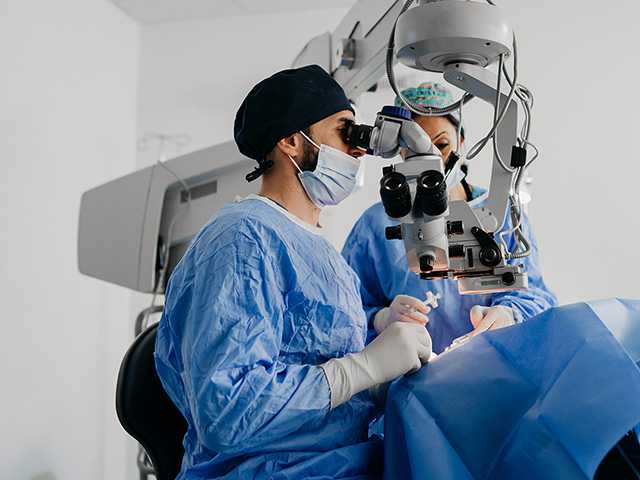 Corewell Health ophthalmology specialist performs surgery on a patient