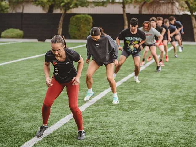 A group of young individuals training at the Corewell Health Sports Performance Center.