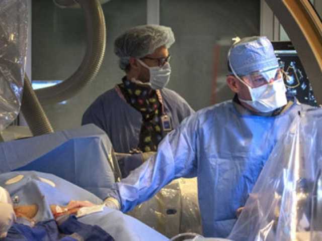 Doctors working on a young patient