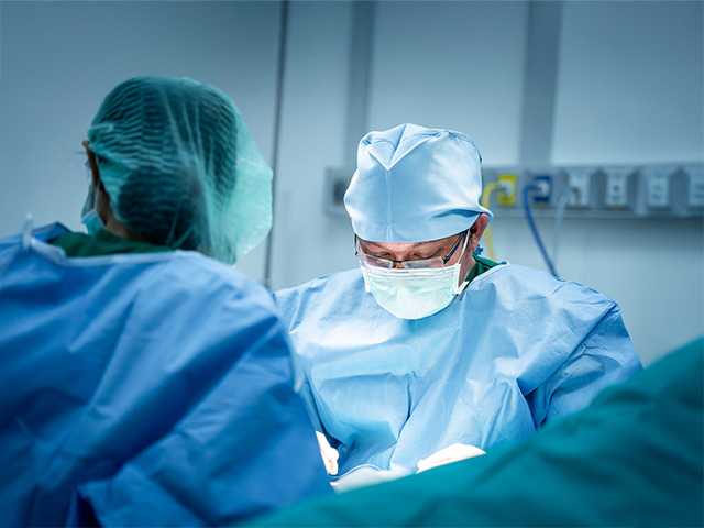 Corewell Health neurosurgeon performs a procedure in the operating room